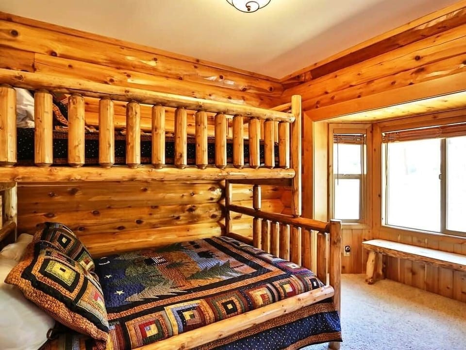 This bedroom includes a delightful bunk bed with enough room to sleep three people.