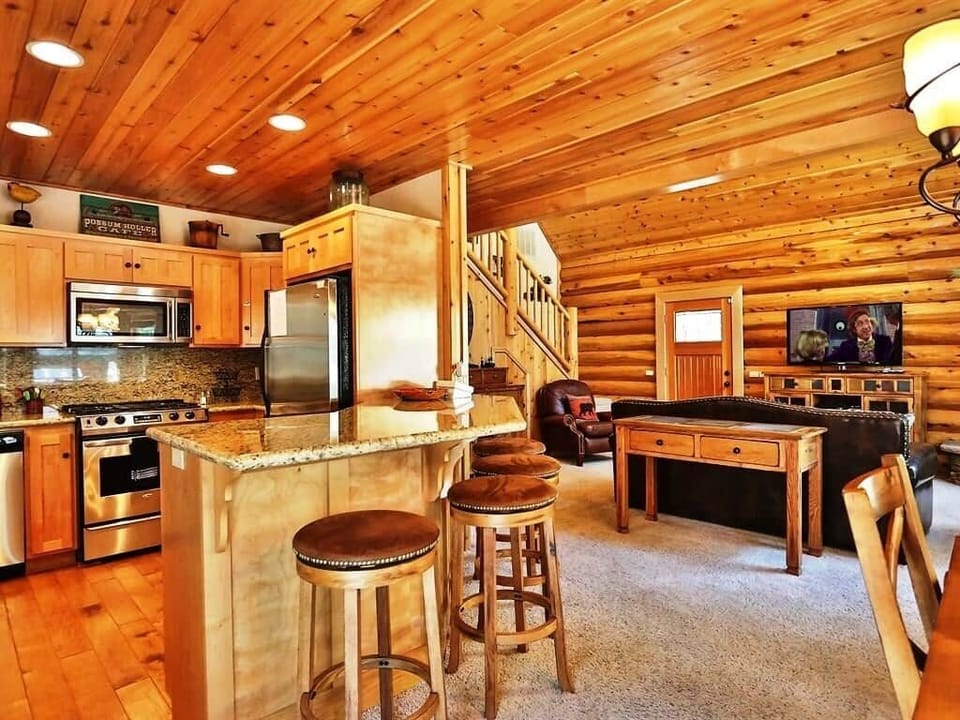 Beautiful kitchen, bar, comfy stools and cozy dining room with a fireplace make this a fun place to spend quality time alone or with those you love.
