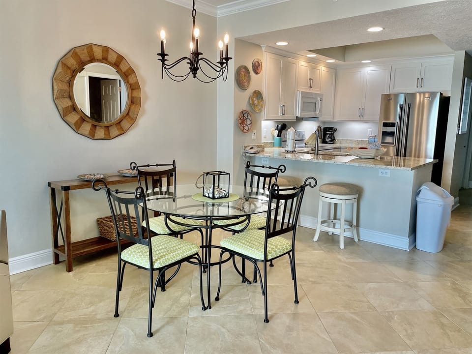 Seating for four at the dining table and two extra at the kitchen bar.