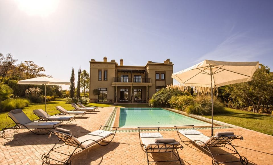 Outdoor pool, a heated pool, pool umbrellas, sun loungers