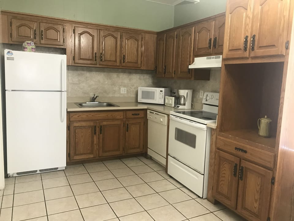 Deluxe Apartment, 2 Bedrooms, Kitchen, City View (Shared Balcony, A02) | Private kitchen | Full-size fridge, microwave, oven, stovetop