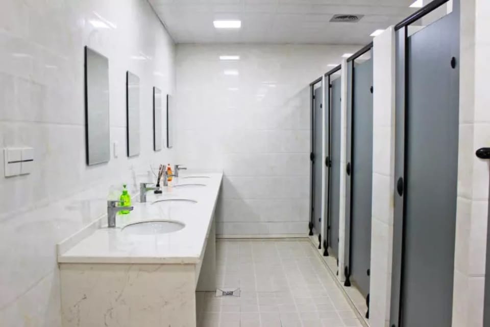 Shower, hair dryer, slippers, towels