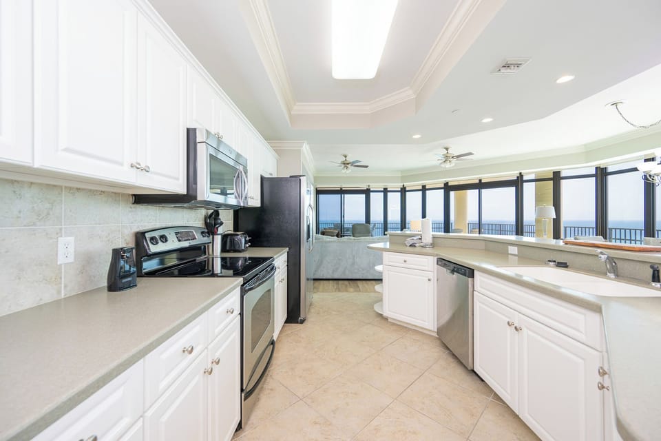 Prepare fresh meals in the kitchen while the living room's cozy seating awaits your family's stories and laughter