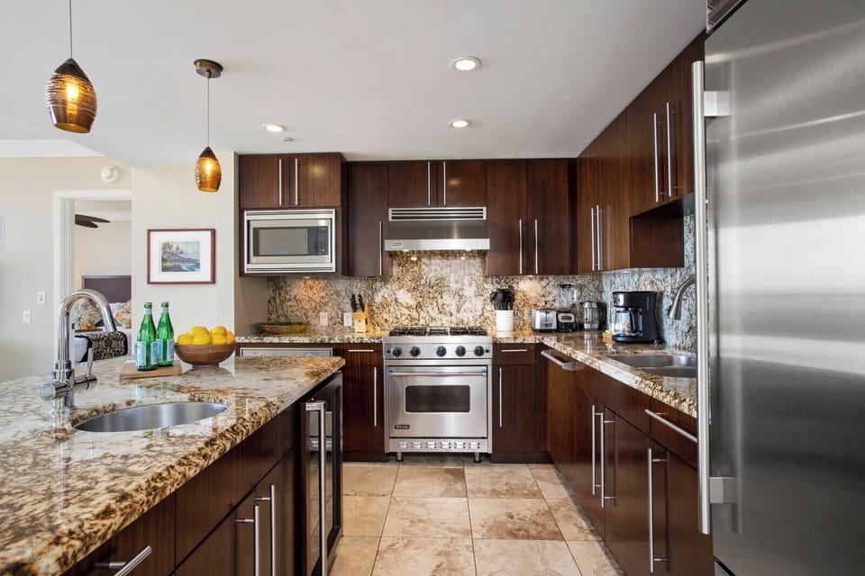 Whip up culinary delights in this sleek and fully-equipped kitchen