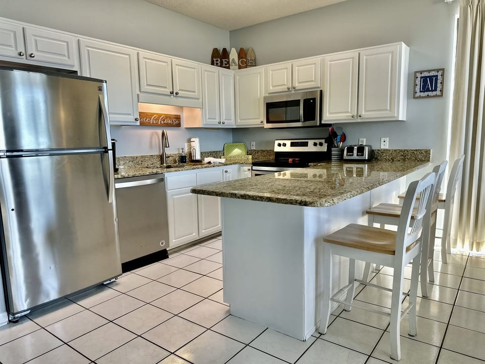 Beautiful, spacious kitchen with granite and stainless appliances.