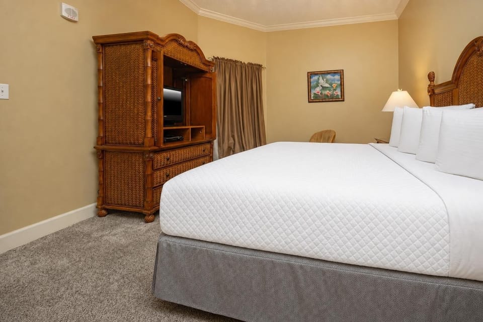 Relax on the cozy king bed in this guest suite and stream your favorite shows after a beach day