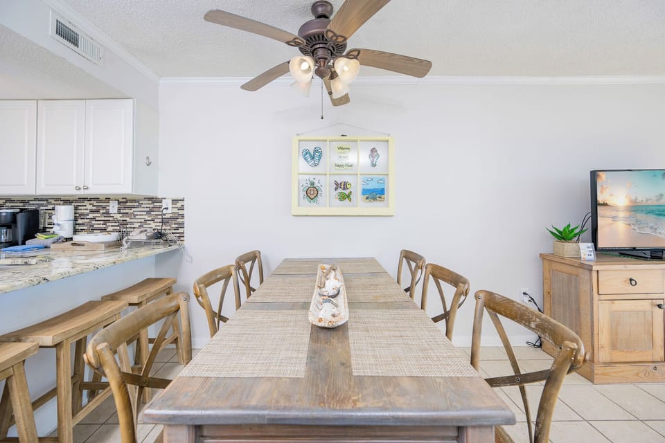 Gather around the inviting dining table, sharing laughter and stories as you soak in the coastal vibe