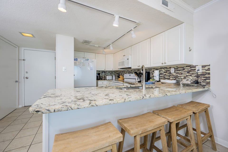 Savor quality time at the breakfast bar, crafting your favorite drinks and snacks while enjoying family chats