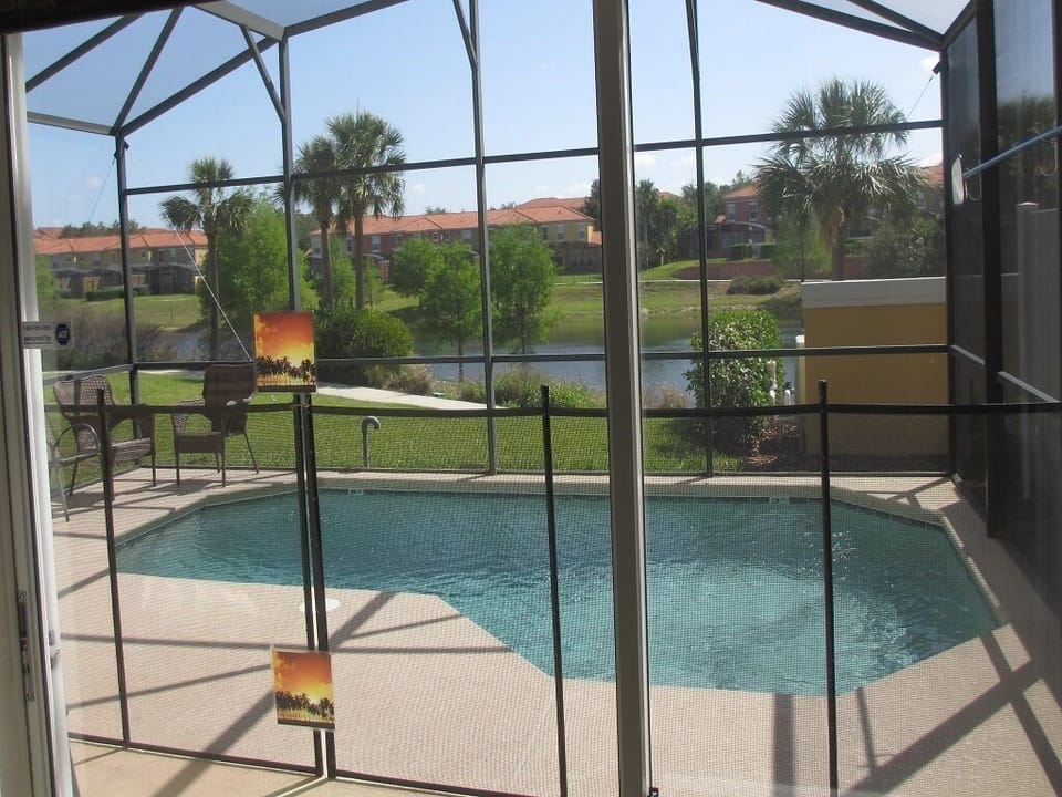 Patio area, pool and lake view from the dining room