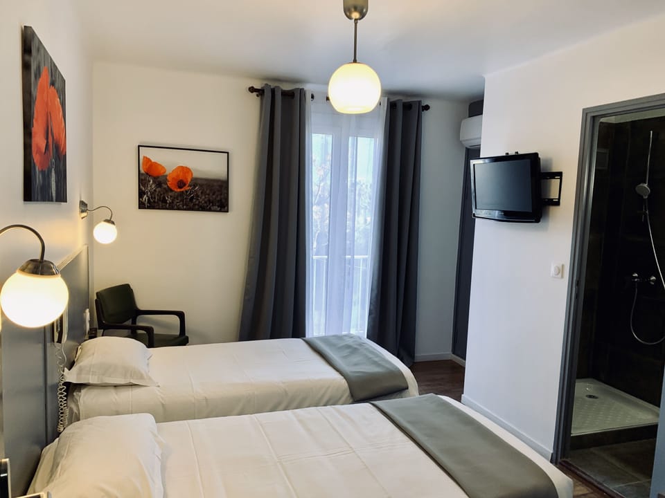 Twin Room (Twin Comfort) | Desk, blackout drapes, iron/ironing board, free WiFi