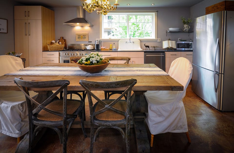 Fully stocked kitchen, stainless steel appliances, genuine farm sink, chef's gas stove.