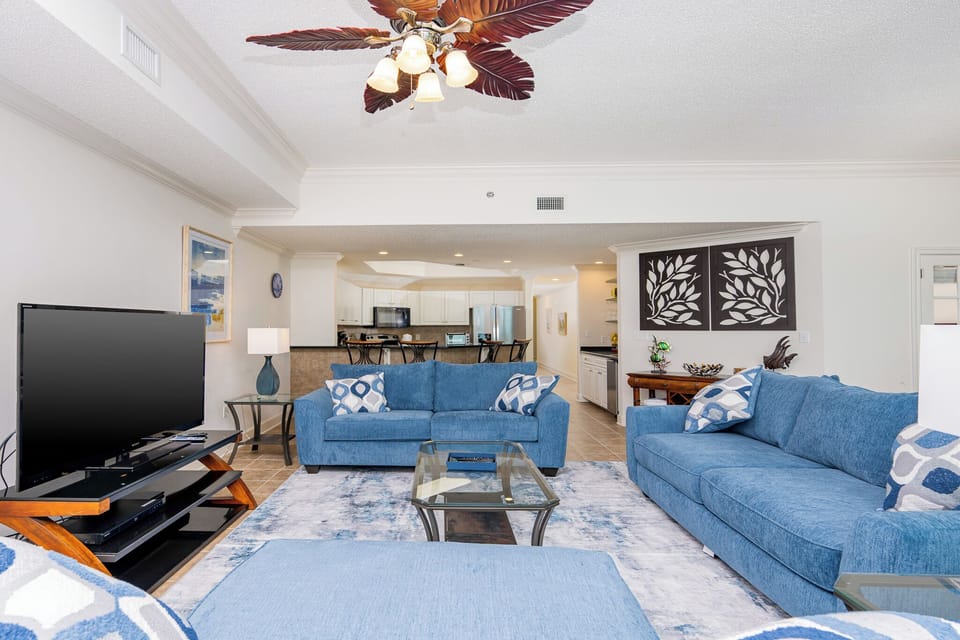 Relax on the cozy sofa with a queen sleeper in this inviting family room with breathtaking beachfront views