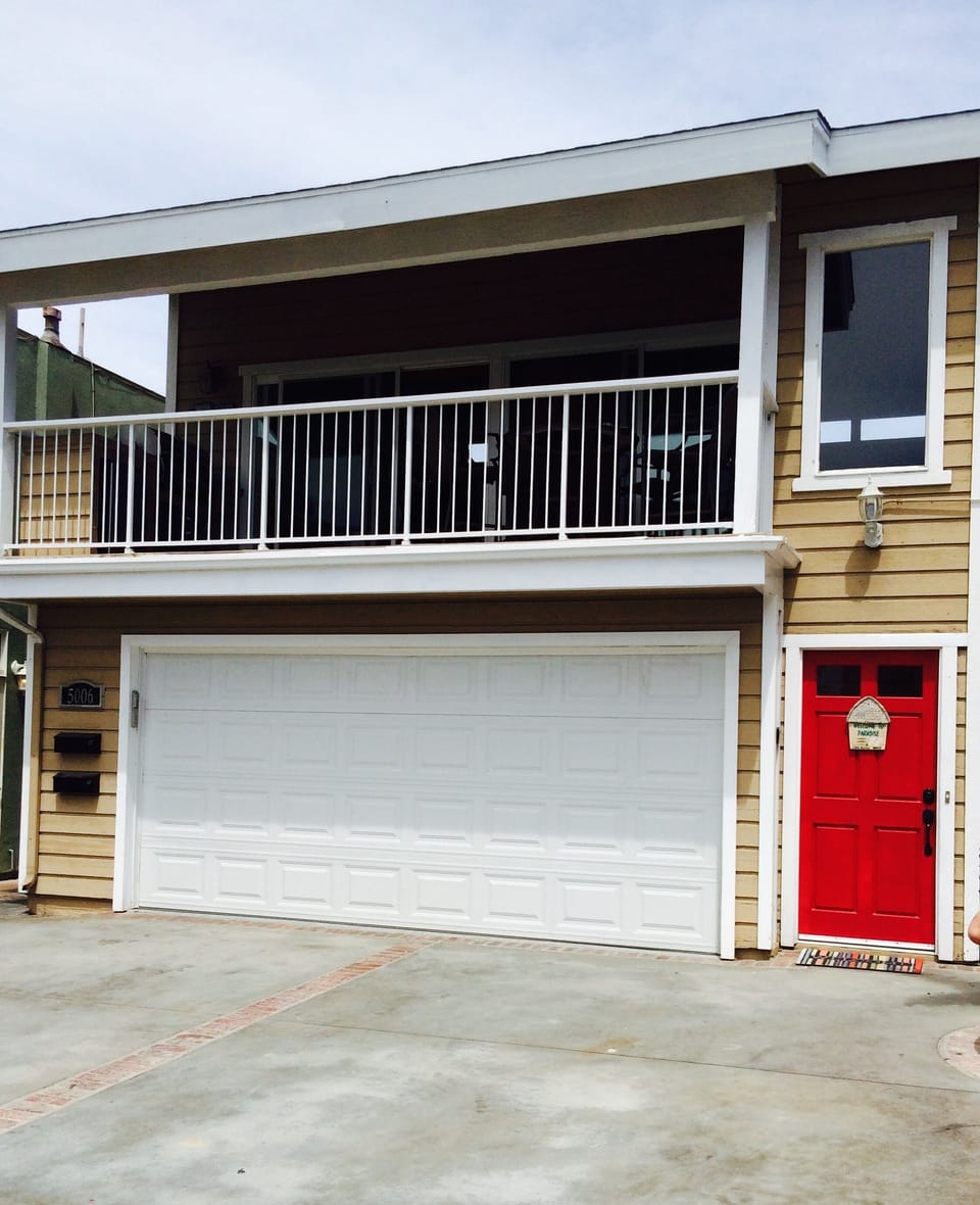 View of the front of the property. Red door is upstairs listing #63877.