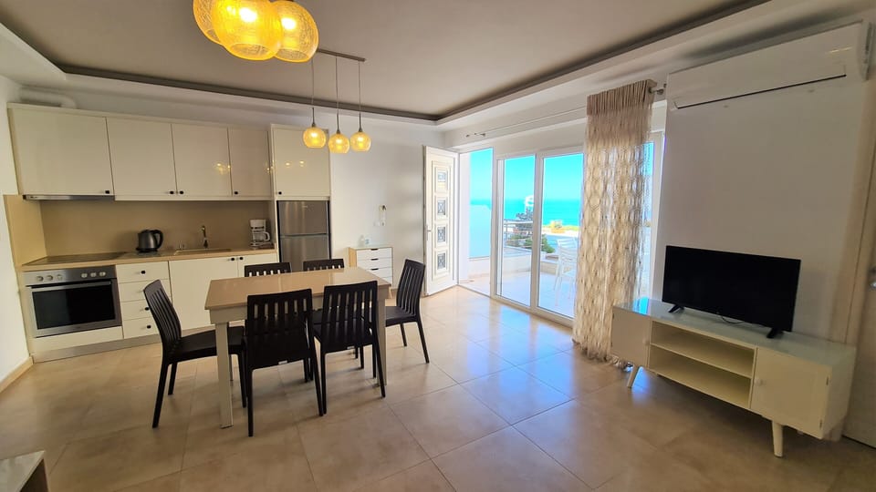 Family Apartment, 2 Bedrooms, Terrace, Sea Facing (Celosia) | Living area | 32-inch flat-screen TV with satellite channels, TV, DVD player