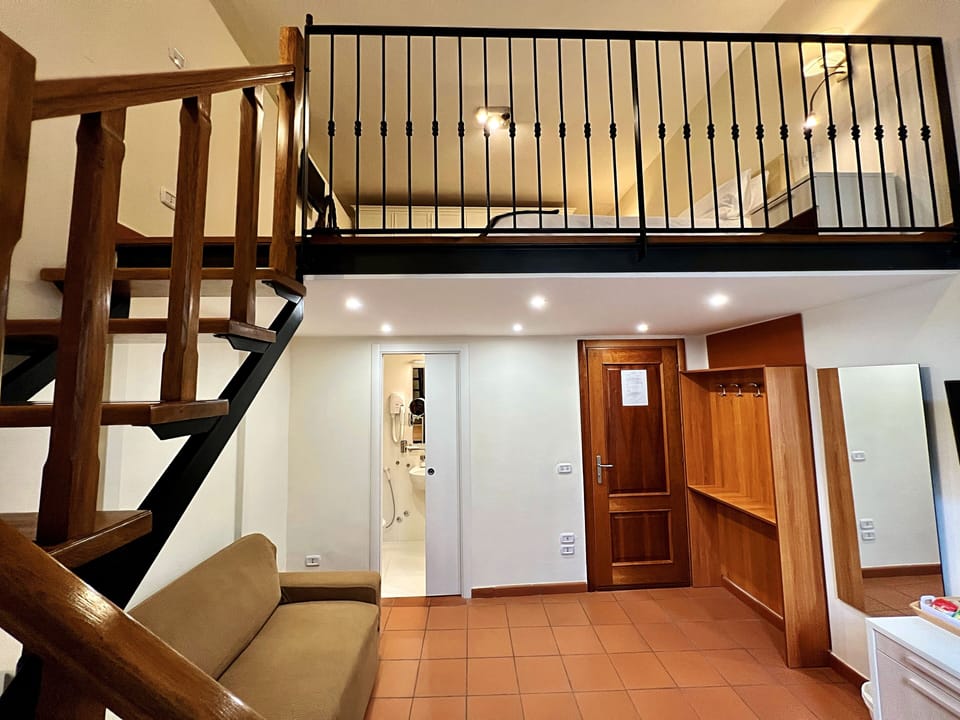 Deluxe Quadruple Room, 1 King Bed | Living area | Smart TV, Netflix, streaming services