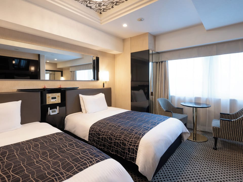 Deluxe Twin Room | Down comforters, desk, free WiFi, bed sheets