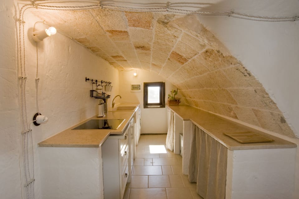 Apartment (Il Nido) | Private kitchen | Mini-fridge, coffee/tea maker, electric kettle, highchair
