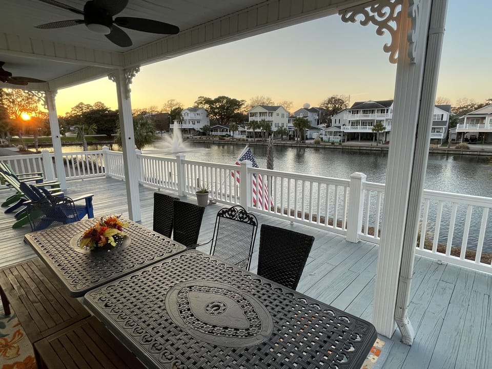 View from our porch of Sandlapper Lake and the fountains.  Tables seat 12
