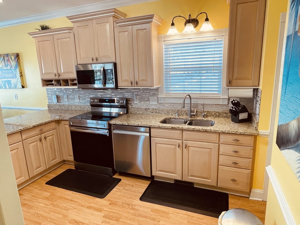 Kitchen upgraded in 2021 with granite and new stainless appliances