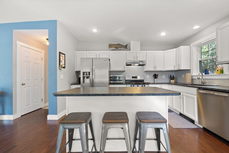 Chef's kitchen with granite countertops and a large island