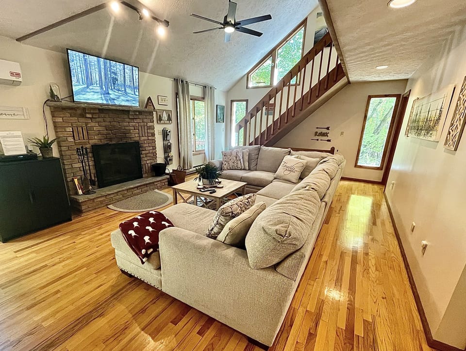 Large comfy sofa for gathering in front of the fireplace.