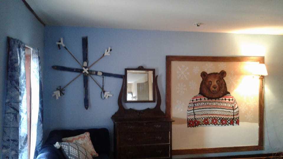 Hand painted bear mural .This bedroom has 2 full beds and private bath
