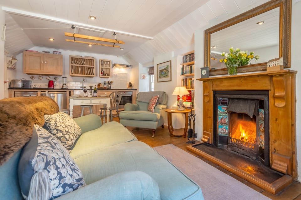 The cosy sitting room, perfect for unwinding after a day of exploring Cornwall