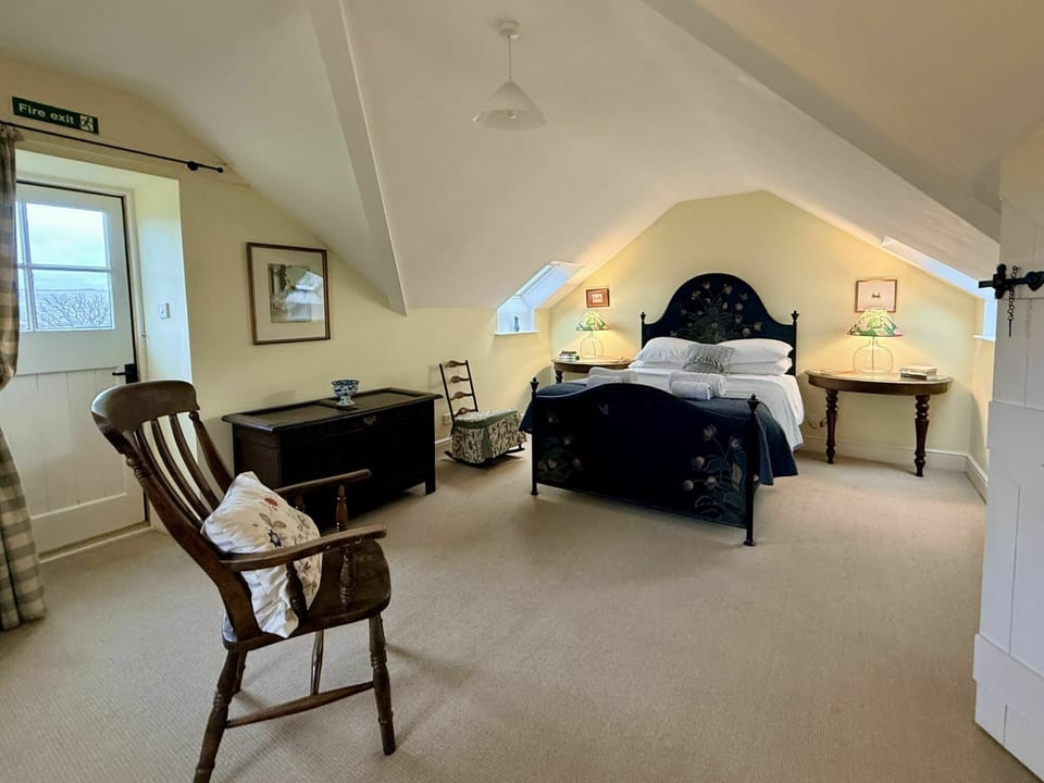 First floor: Master double bedroom with 5' king-size bed and en suite bathroom with shower over bath