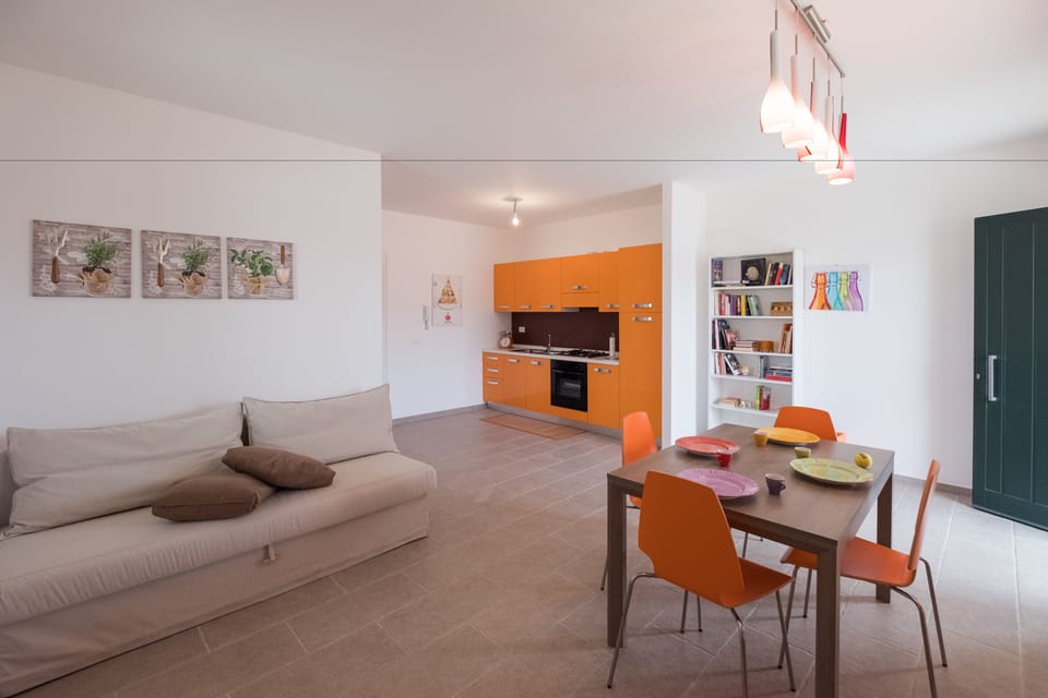 Deluxe Apartment, 2 Bedrooms | Living room | Flat-screen TV