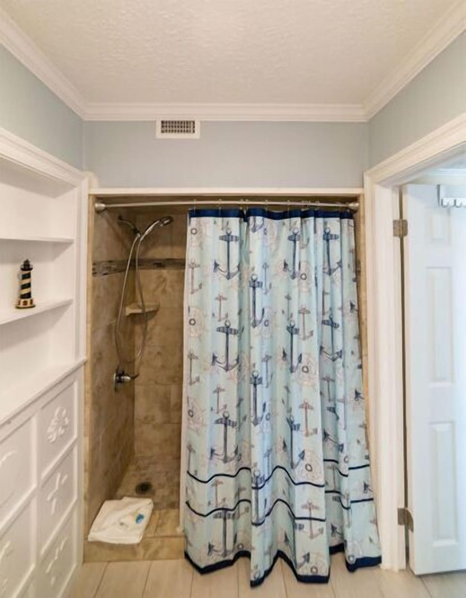 The guest bathroom offers a walk-in shower