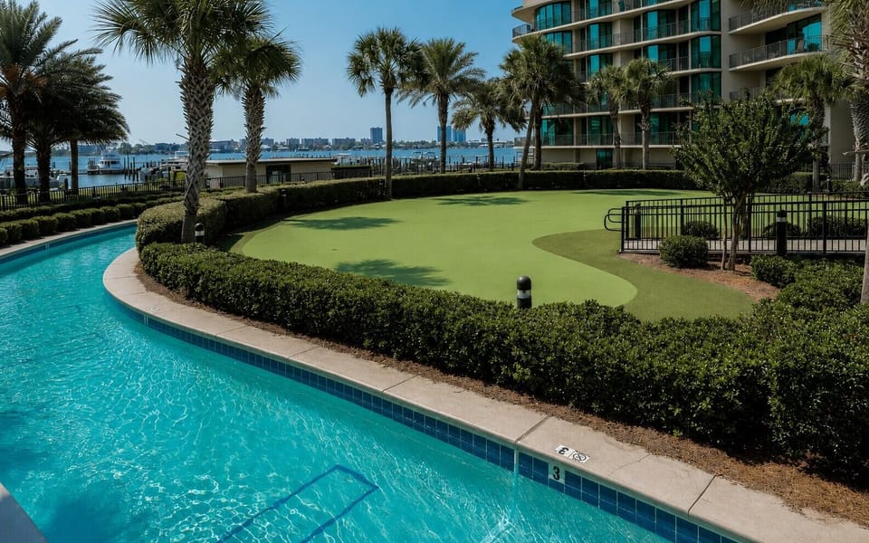Discover the putting green surrounded by coastal landscaping and the lazy river during your stay at Phoenix on the Bay