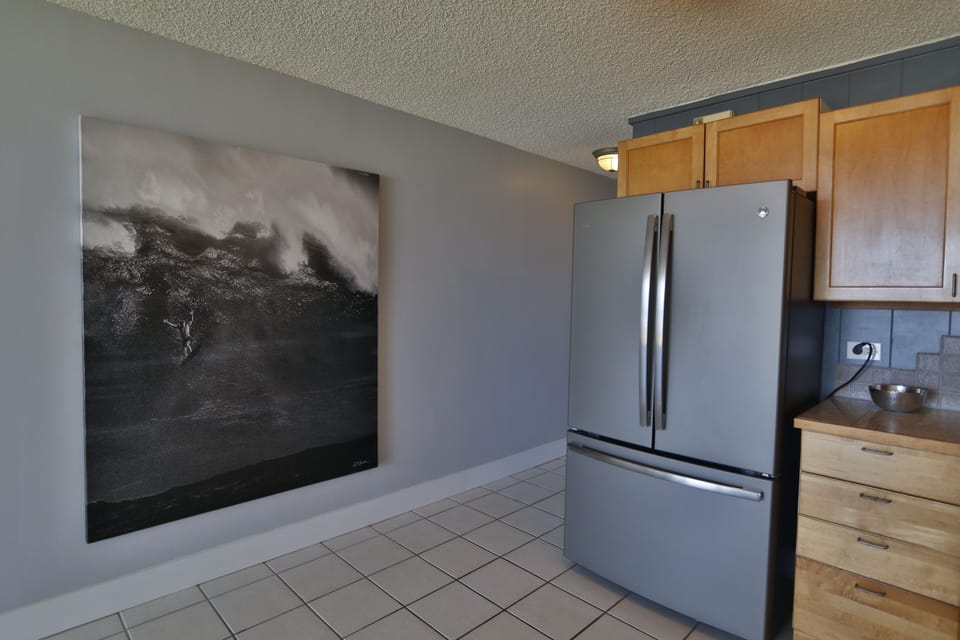 Breathtaking photo art of big-wave surfer Laird Hamilton featured on kitchen wall