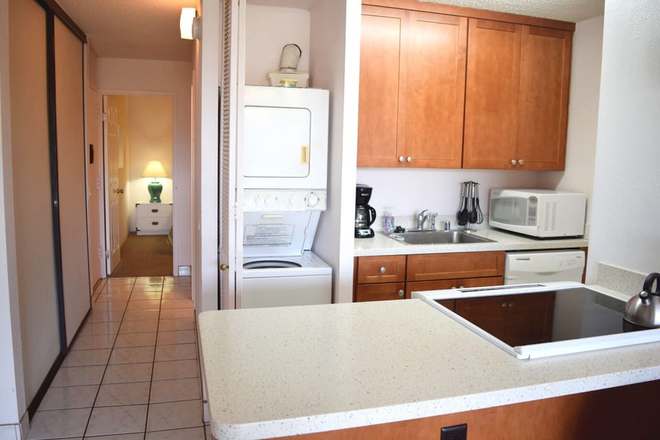 In unit washer/dryer in closet next to kitchen