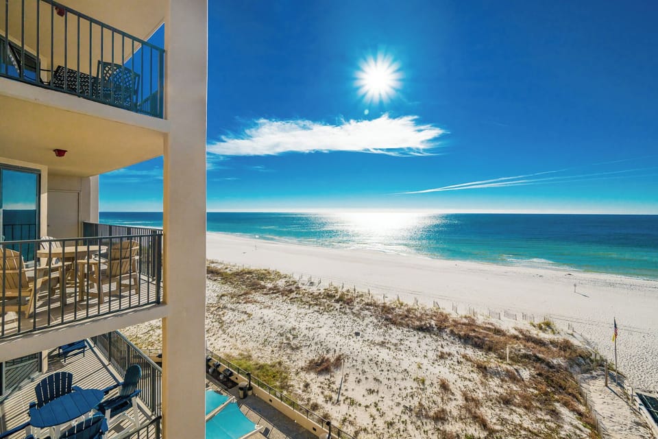 Savor your morning coffee on the balcony while enjoying breathtaking views of the water and beach