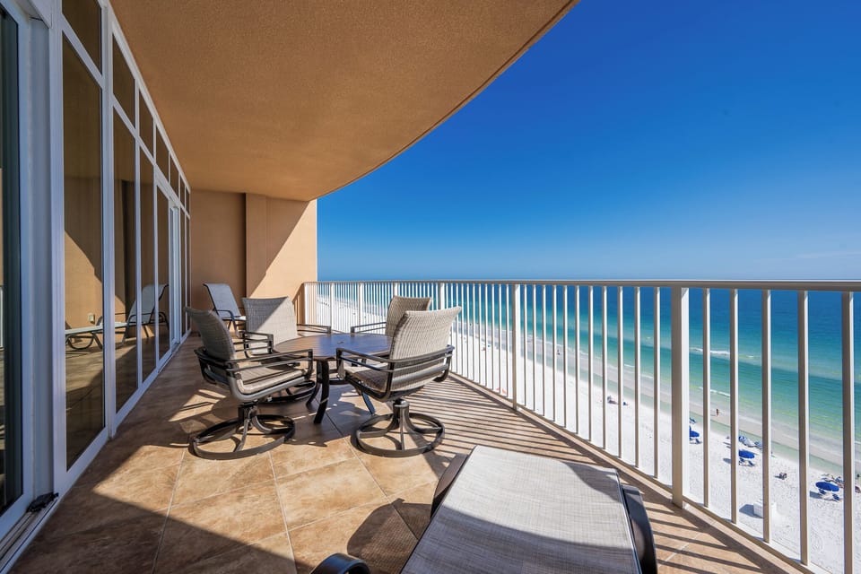 Relax on the spacious balcony with comfortable seating and enjoy the breathtaking views of the tranquil waters