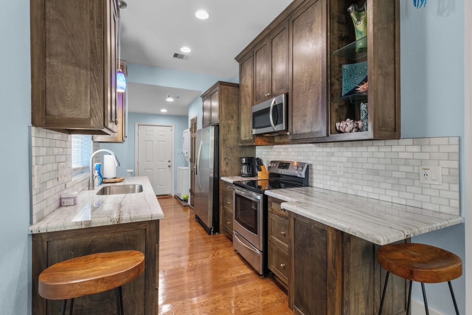 Modern kitchen. Stocked with dishes and cookware