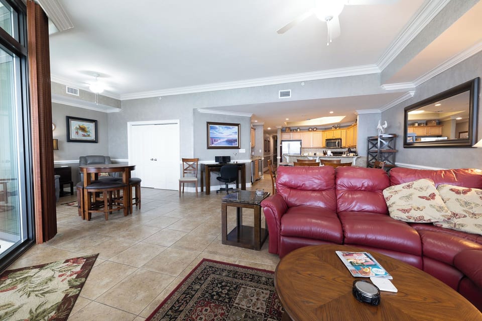 Relax in the plush sofa with a full sleeper, surrounded by inviting decor as you plan your family's beach adventures