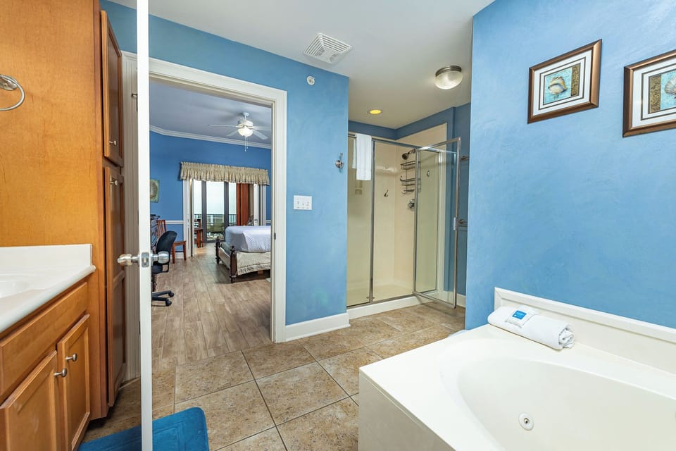 Indulge in a refreshing shower in the master bath, surrounded by calm colors that enhance your relaxation