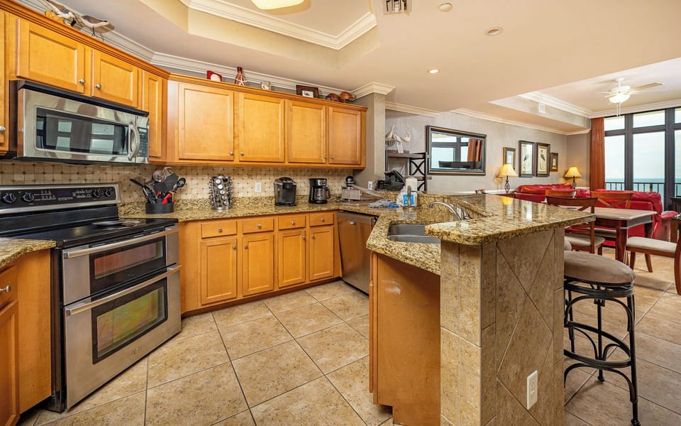 Craft delicious meals in the inviting kitchen while enjoying the beach vibe that fills the space around you