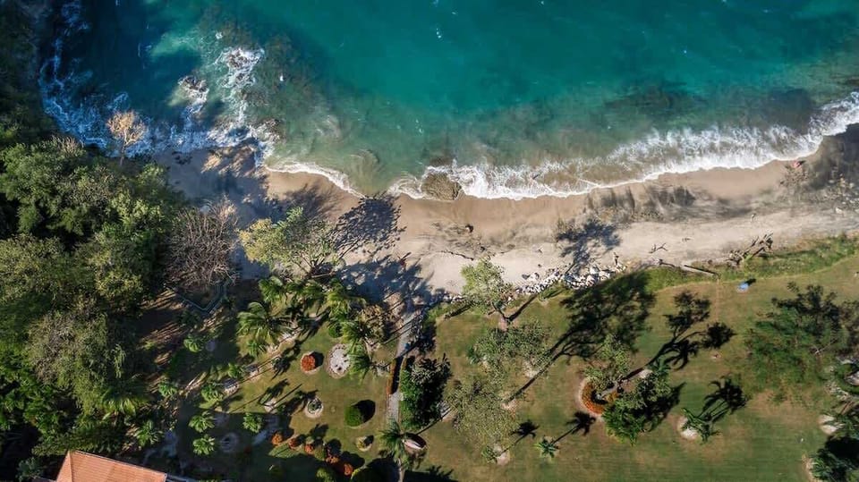 Aerial view of the semi-private beach in front of Flamingo Marina Cove 617