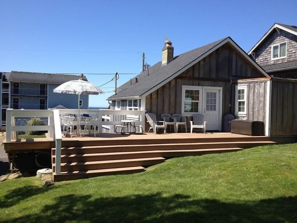 Large grass backyard with large new deck. BBQ and lots of comfortable seating.