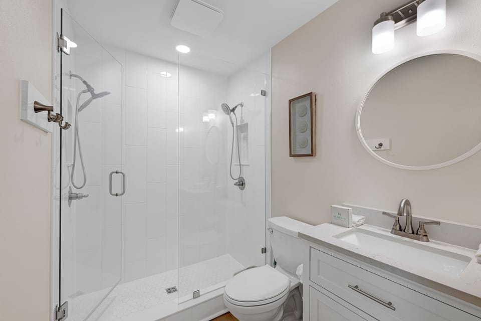 The private bathroom features a walk-in shower