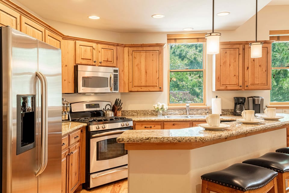 Stainless Steel Appliances, Granite Countertops, Desk Area and Island Seating for 3