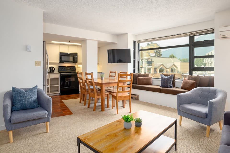 Enjoy meals or game nights at the dining table with village views.