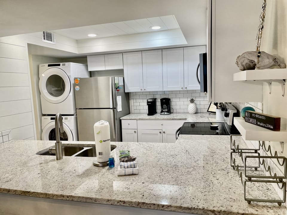 There are shiplap walls and a subway tile backsplash in this perfect kitchen!