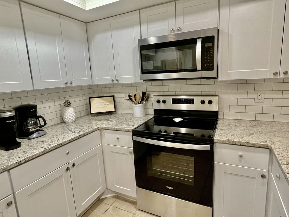 Our coastal kitchen has brand new appliances and granite counter tops.