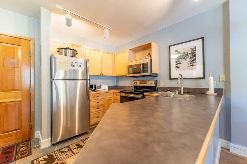 Your fully equipped kitchen features stainless steel appliances and generous counter space for cooking memorable vacation meals together.