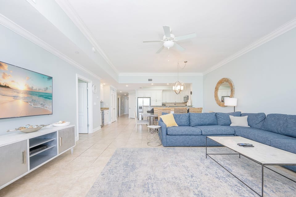 Relax in this open living space enjoying the soft decor and the inviting atmosphere on your beach vacation