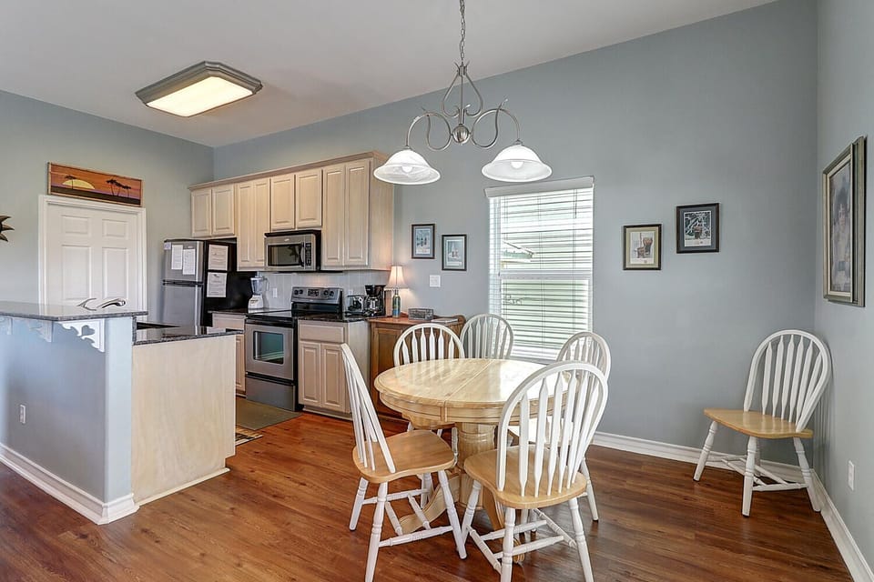 Gather around your bright dining space with charming farmhouse chairs, while the fully-equipped kitchen invites you to create memorable meals together.
