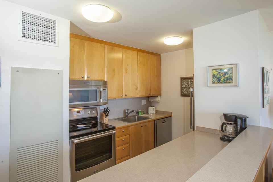 Your fully equipped kitchen has everything you need: a stove, oven, microwave, dishwasher, and coffee maker ready for home-cooked meals and easy mornings.